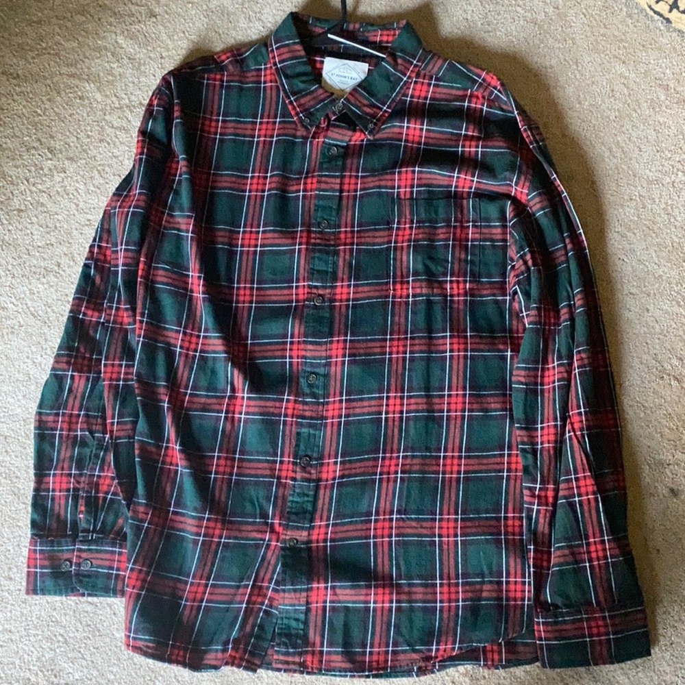 Hundred percent cotton button down collar shirt .